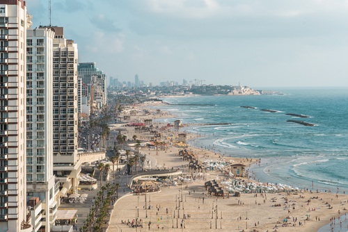 ISRAEL, Tel Aviv, a view of the city's beaches and promenade, Jaffa in the far background. 2016, Beach, Beach Umbrellas, Bird View, Blue Water, Buildings,