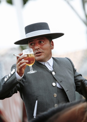 Portrait of a man wearing traditional suit during the April Fair, Seville, Spain.. Andalucia, Andalucian, Andalusia, Andalusian, Espana, Europe, Europian,